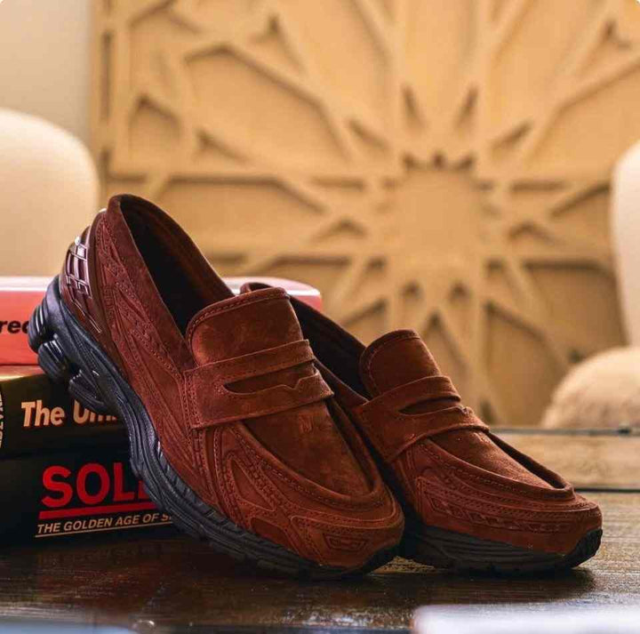 brown New Balance 1906 casual slip-on sneakers with mesh fabric and rubber sole