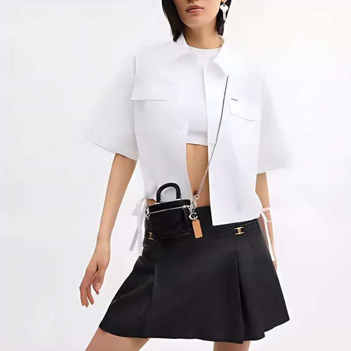 حقيبة كوتش تريل 12 ميني سوداء بسلسلة كتف فضية وتصميم أنيق فاخر