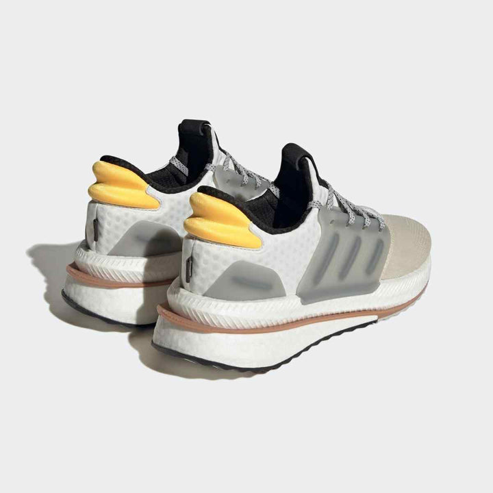 adidas UltraBoost gray and yellow sneakers with BOOST technology and mesh upper.