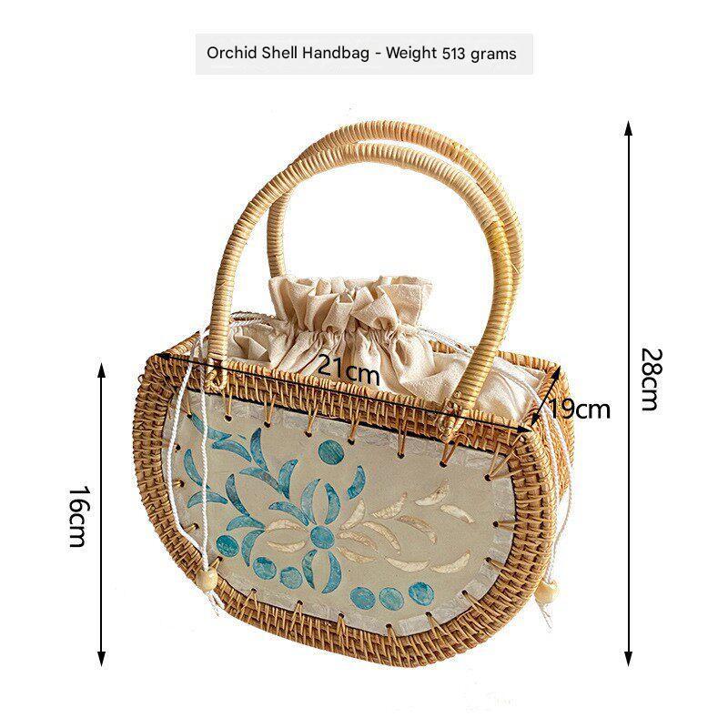 حقيبة يد Handbag من الخوص الطبيعي بتصميم فني يدوي مميز.