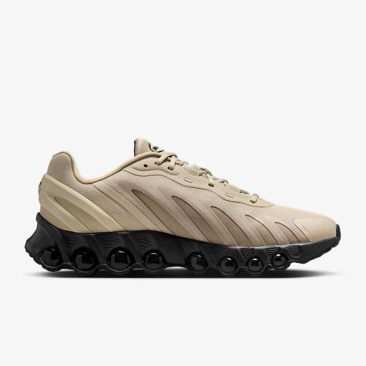 Nike Air Max DN8 low-top shock-absorbing men's sneakers in beige with black sole.