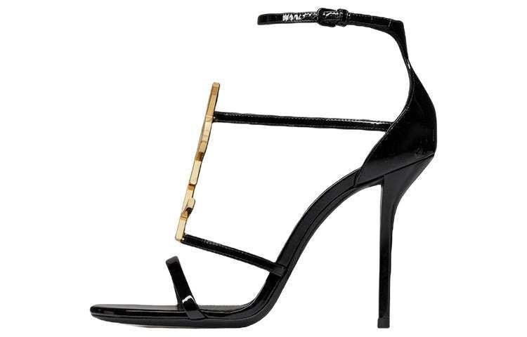 صندل كعب عالي Saint Laurent بتصميم شعار YSL ذهبي ولون أسود.