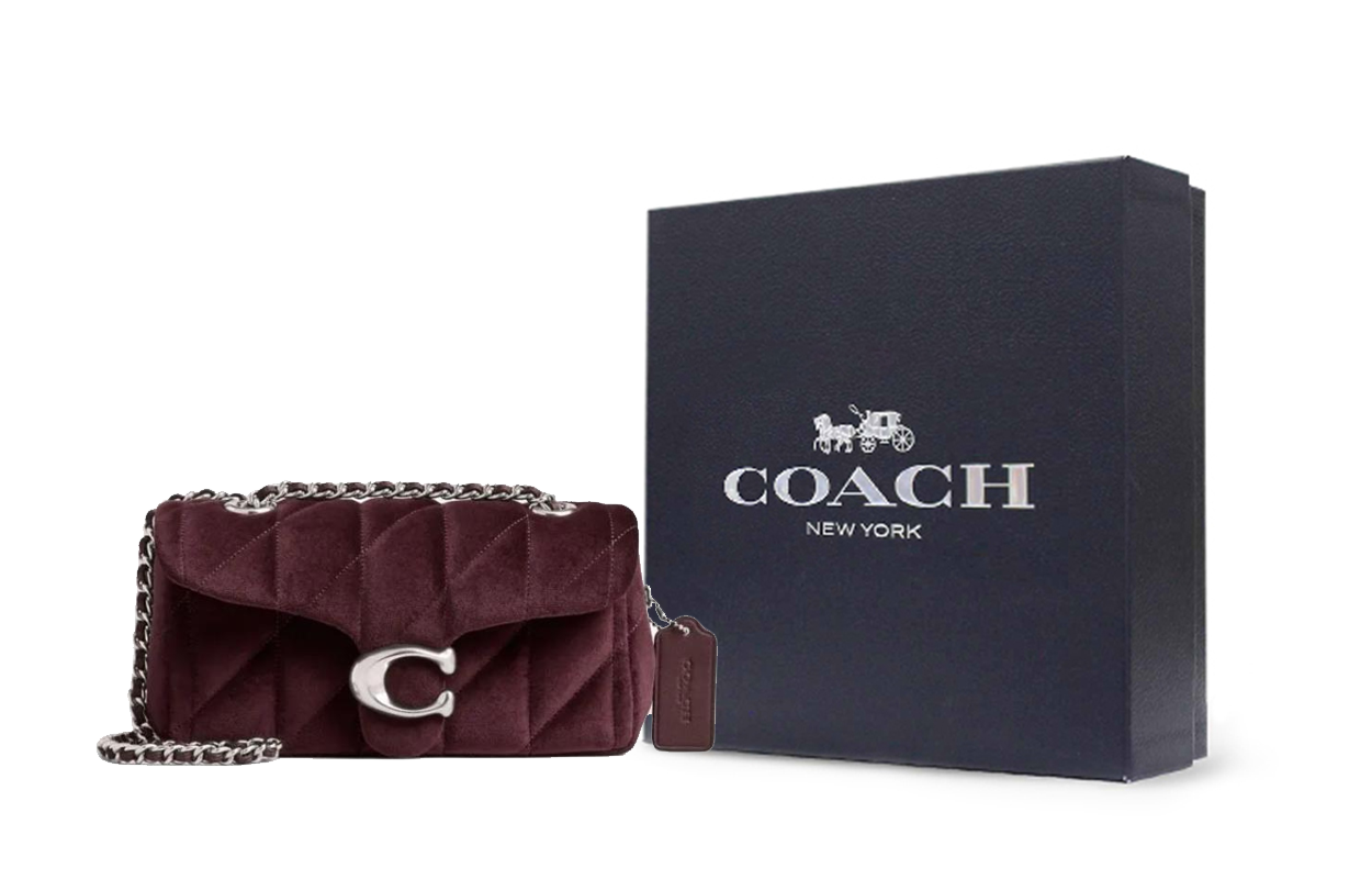 حقيبة كتف Coach مخمل مبطنة لون عنابي.