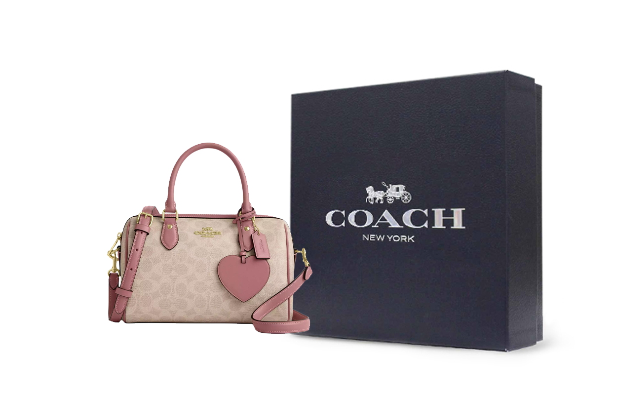 حقيبة Coach Rowan Satchel مع صندوق التغليف الفاخر الخاص بالماركة، مثالية للهدايا.