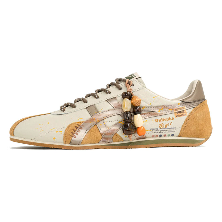 حذاء أونيستا تايغر رانسبارك برتقالي وأصفر بتصميم خاص جلد ناعم ونعل مطاطي مع تفاصيل فنية وشرائط معدنية