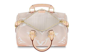 حقيبة Louis Vuitton Speedy Bandoulière بتصميم وردي متدرج.