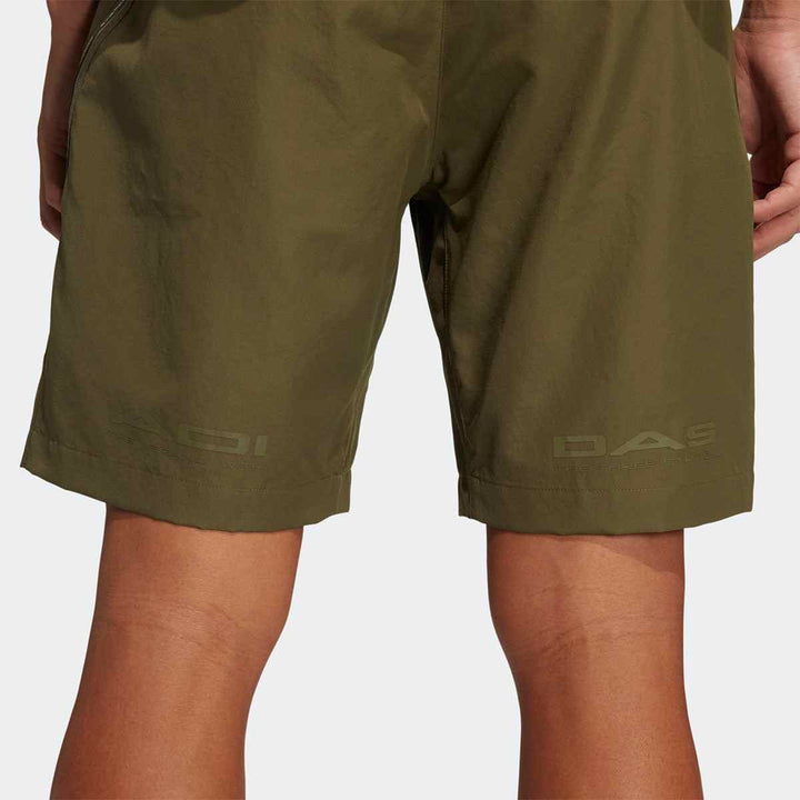 adidas men's breathable running pants in olive green, back view.
