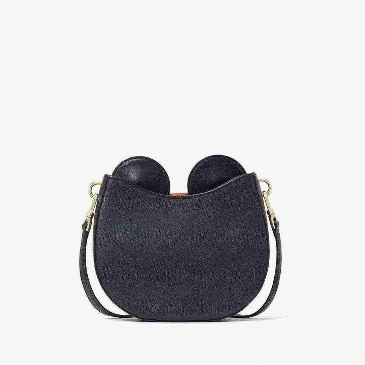 Elegant Kate Spade Minnie Mouse-inspired bag with red bow and adjustable strap.