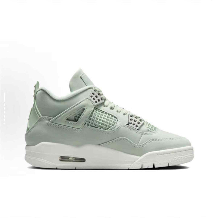 Air Jordan 4 Retro Seafoam sneaker in light green with metallic silver accents and durable rubber sole.