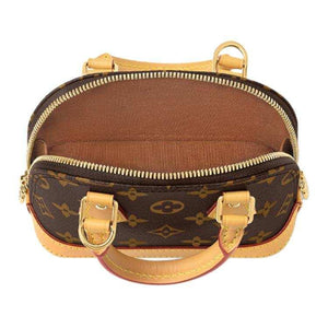 حقيبة Louis Vuitton Alma Nano بنقشة Monogram الأيقونية.
