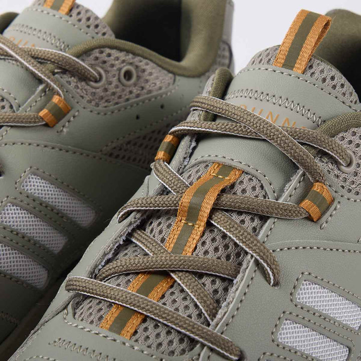 adidas JZ Runner olive and gray shoes with orange accents, durable mesh and leather design.