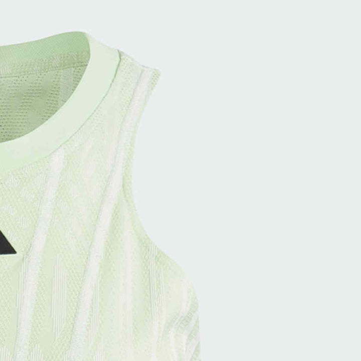 adidas Women's Sport Dress IL7364 in light green with textured fabric and sleeveless design.