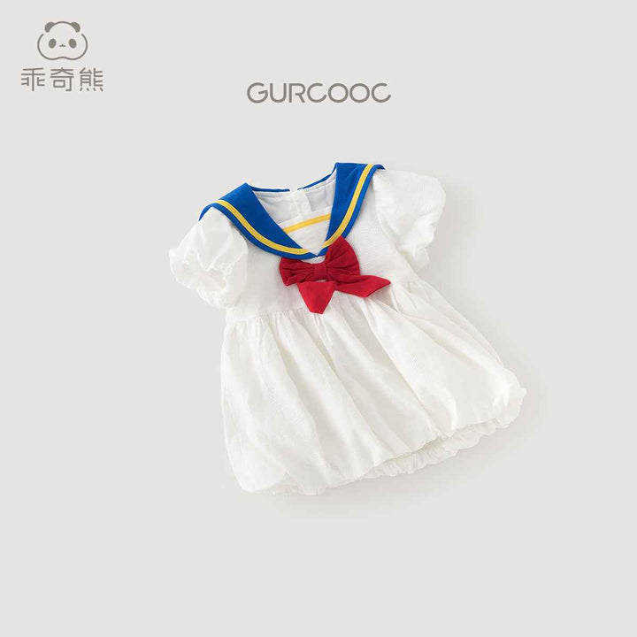 College style girls' dress in navy style with red bow and blue trim, short sleeves for summer outings.