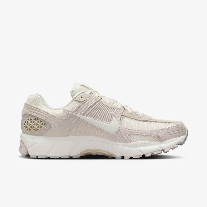 Nike Zoom Vomero 5 sneaker in ivory, featuring mesh and leather, Zoom Air cushioning, and durable outsole.