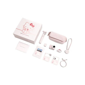 Complete box contents and accessories of the limited edition Hello Kitty Insta360 GO Ultra including the pink action pod, carrying case, mini selfie stick, and magnetic pendant.