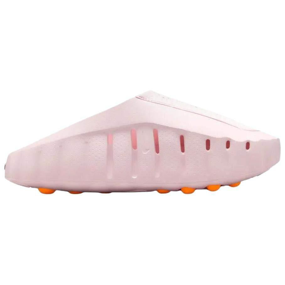 Studio profile shot of the Nike Mind 001 baby pink slide, highlighting its sleek architectural silhouette and lower ventilation slits.