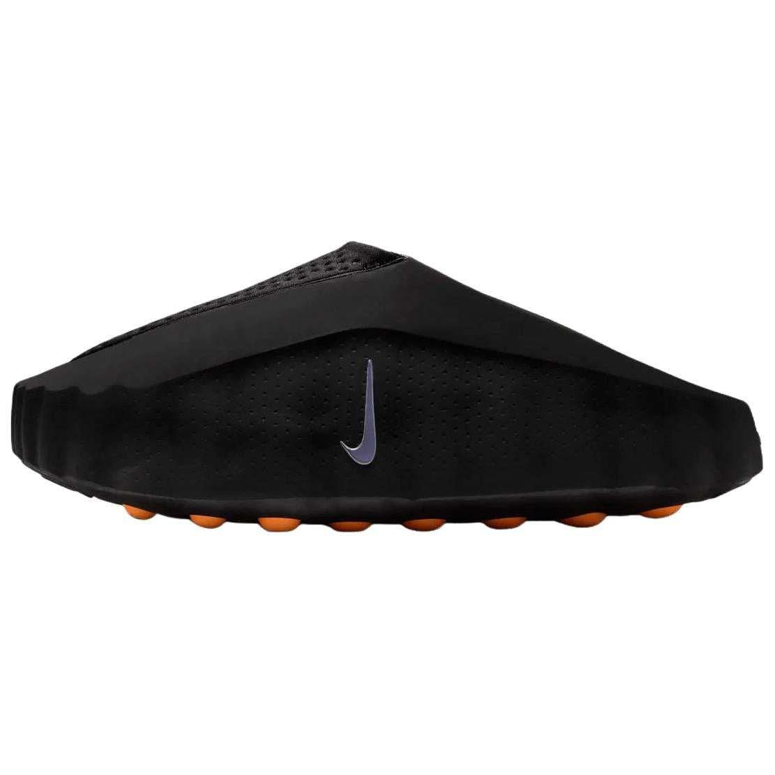 Side profile view of the Nike Mind 001 slip-on shoe in matte black, showcasing its unique structured design, a silver swoosh, and bright orange outsole pods.