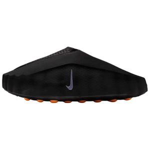 Side profile view of the Nike Mind 001 slip-on shoe in matte black, showcasing its unique structured design, a silver swoosh, and bright orange outsole pods.