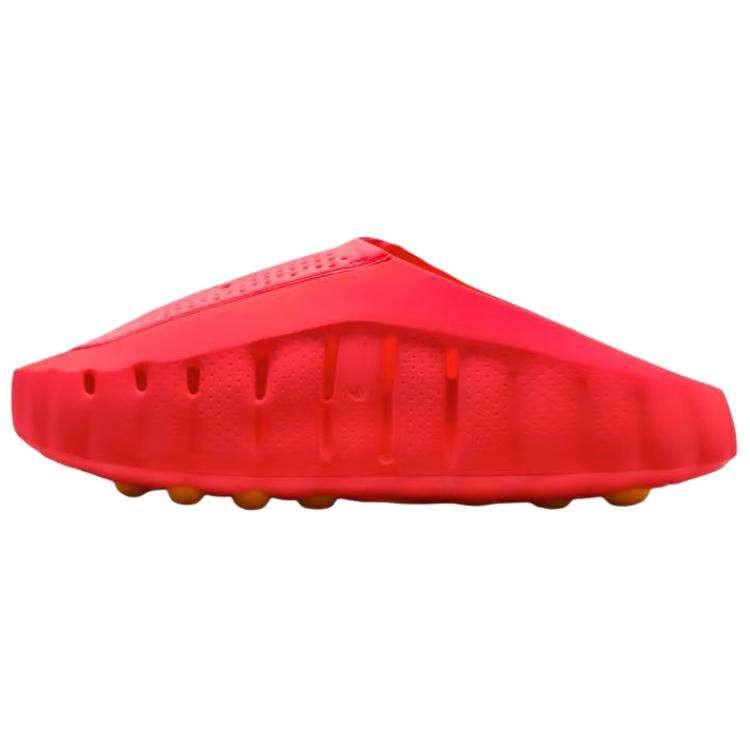 Side view of the Nike Mind 001 slip-on shoe in vibrant neon orange, showcasing its minimalist architectural design and black Nike swoosh.