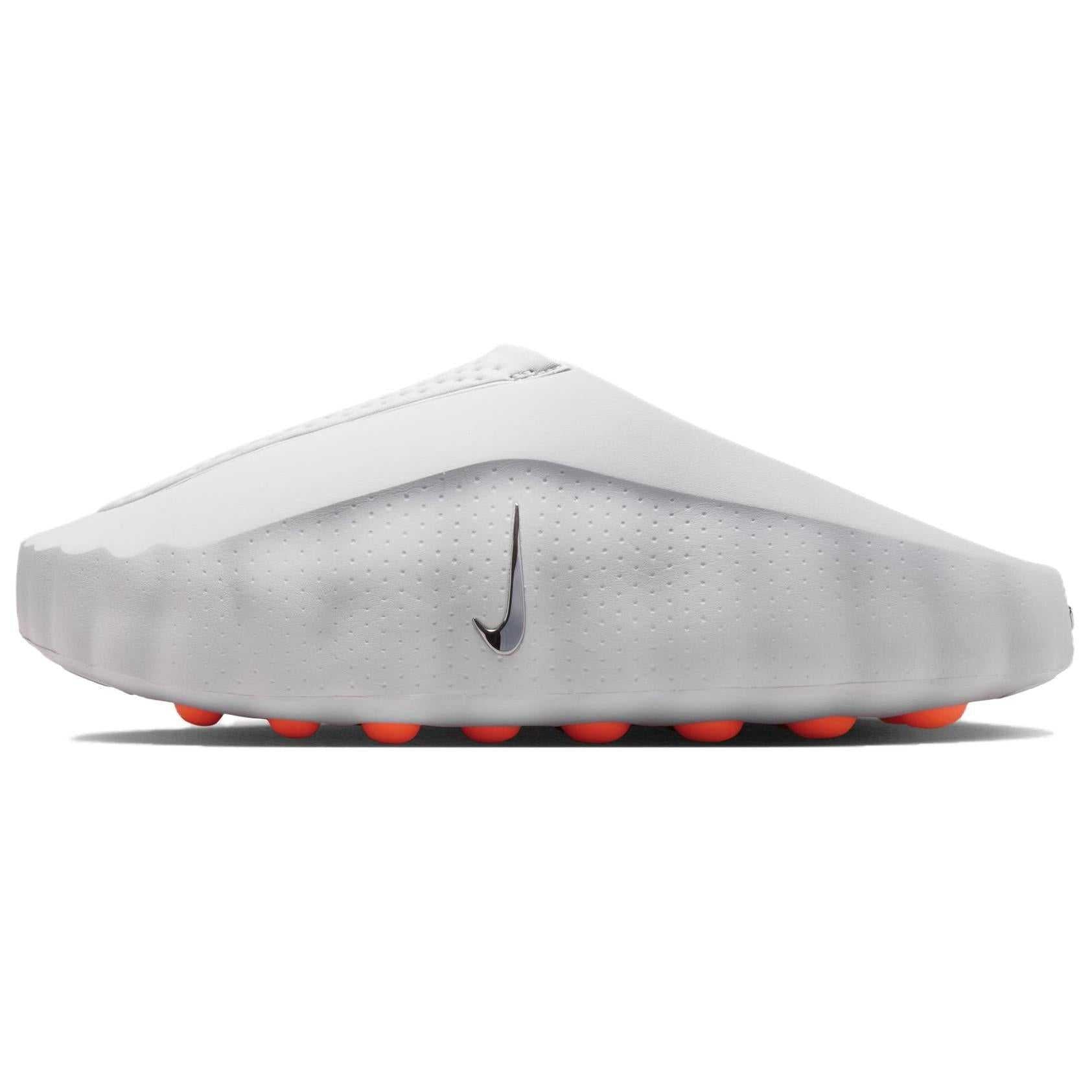 Side view of the Nike Mind 001 recovery clogs in light grey, showcasing the sleek biomorphic foam structure, laser perforations, and signature black swoosh.