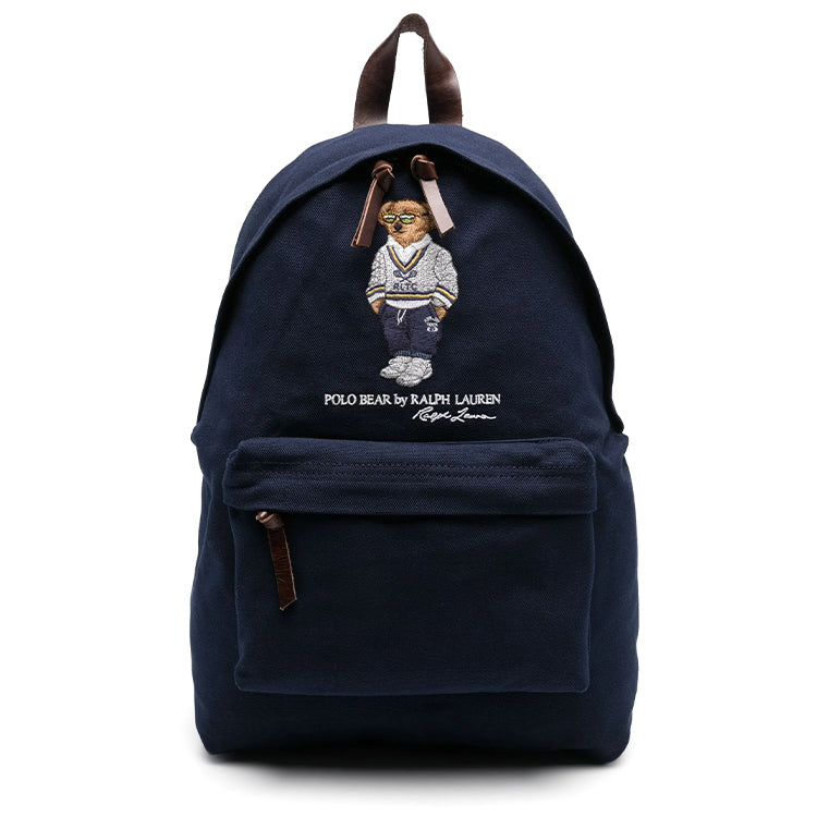 Full front view of an authentic Ralph Lauren Polo Bear navy blue backpack with brown leather handle and zipper straps, perfect for back-to-school season.

عرض أمامي كامل لحقيبة ظهر Ralph Lauren Polo Bear باللون الكحلي أصلية مع مقبض وأشرطة سحاب من الجلد البني، مثالية لموسم العودة للمدرسة.