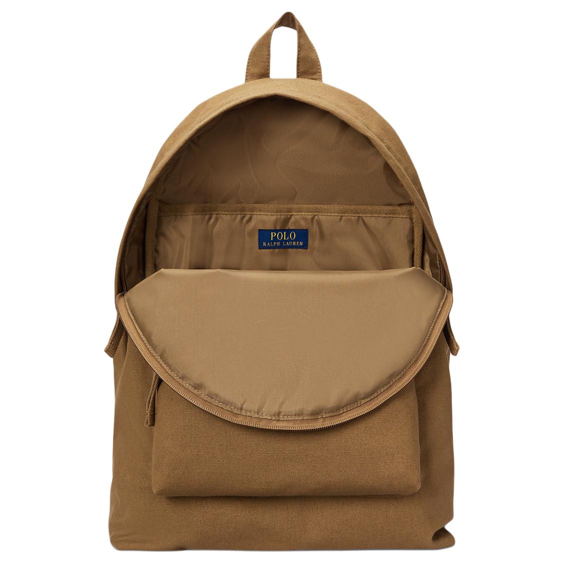 Open interior view of an original Ralph Lauren camel school backpack revealing ample storage space for books and laptop.

عرض داخلي مفتوح لحقيبة ظهر مدرسة رالف لورين أصلية باللون الجملي يوضح مساحة التخزين الوفيرة للكتب والكمبيوتر المحمول.