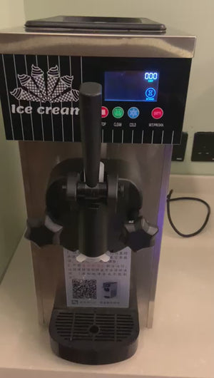 Chef serving fresh soft serve ice cream using a commercial ice cream machine