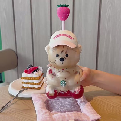 Video preview showcasing the exclusive Starbucks bearista cup pink edition on a wooden table, perfect for shopping.