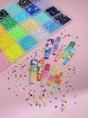 Colorful Nail Art Rhinestones Display
Colorful flatback rhinestones for nail art designs with glue and tools - أحجار الراين وفصوص كريستالية للأظافر