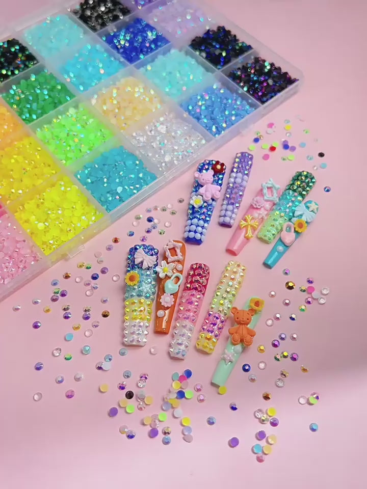 Colorful Nail Art Rhinestones Display
Colorful flatback rhinestones for nail art designs with glue and tools - أحجار الراين وفصوص كريستالية للأظافر