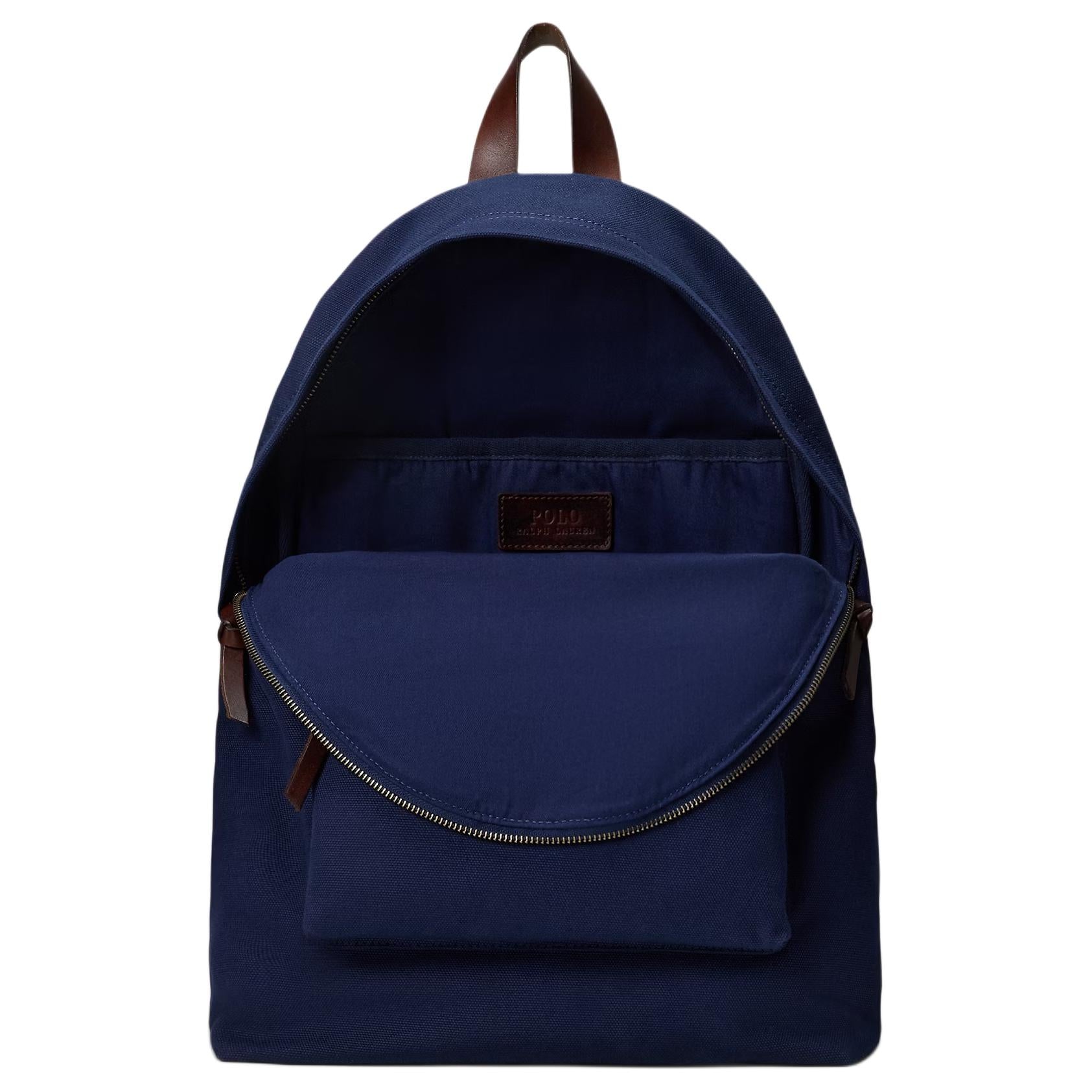 Open interior view of an original Ralph Lauren Polo Bear navy blue school backpack showing spacious storage compartment and interior brand tag.

عرض داخلي مفتوح لحقيبة ظهر مدرسة Ralph Lauren Polo Bear أصلية باللون الكحلي يوضح مساحة التخزين الواسعة وعلامة الماركة الداخلية.