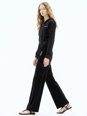 سترة مخمل مرن نسائية Juicy Couture بأحجار لامعة سوداء - رفعة