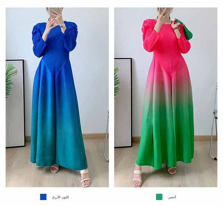 Elegant ombre dress with long pleated sleeves and flowing design, available in blue and red-green colors.