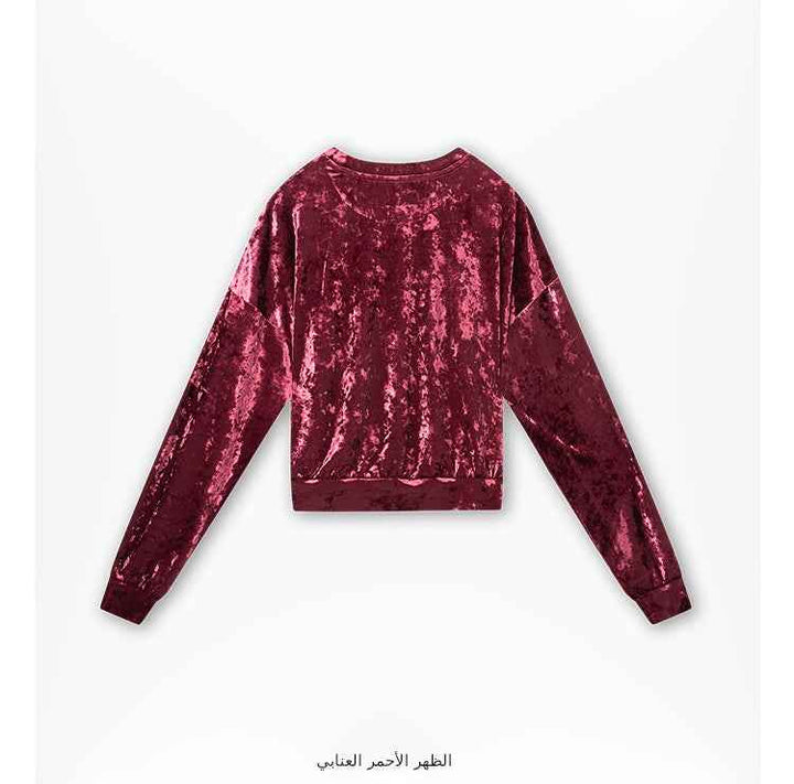 Juicy Couture red velvet blouse with long sleeves and embroidered logo.