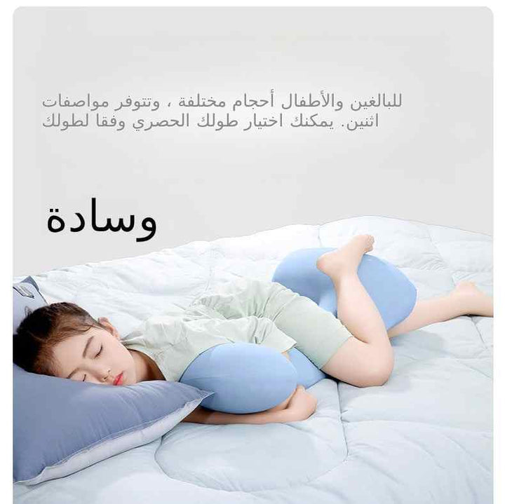 On the bed, ergonomic body pillow for side sleeping.