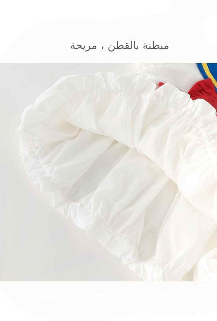 College style girls' dress with white ruffled fabric detail.