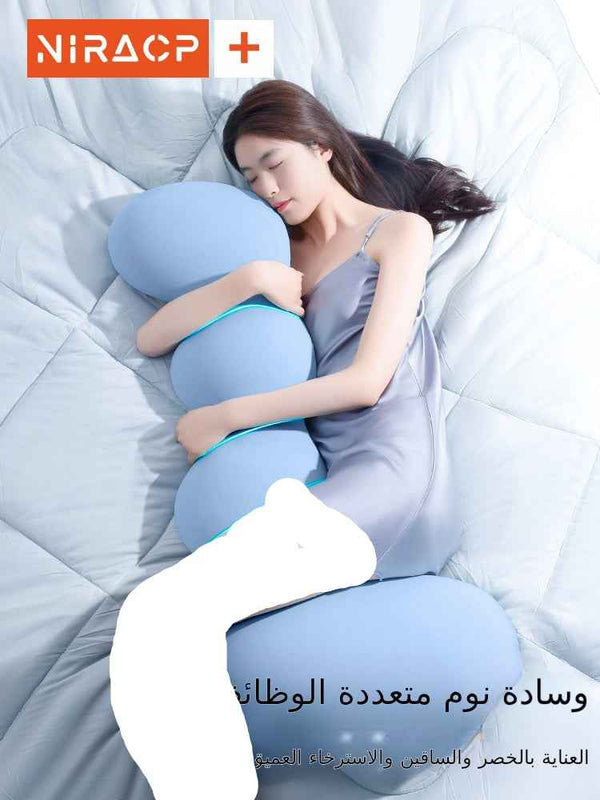 وسادة نوم طبية woman sleeping comfortably hugging blue multifunctional body pillow on bed وسادة نوم متعددة الوظائف
