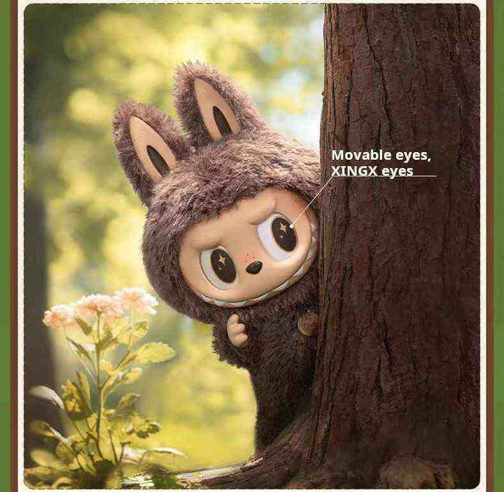 Pop Mart THE MONSTERS vinyl face doll in brown bunny outfit among trees.