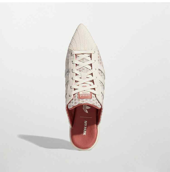 Adidas Ivy Park Mule Pointed-Toe Women's Shoe مع تصميم مفتوح وجريء وأنف مدبب بشبك مزين وطبعات هندسية.