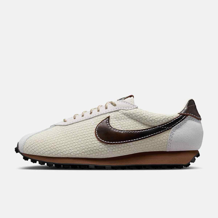 Nike LD-1000 running shoe in soft pearl with black and fauna brown accents, featuring a mesh and leather upper with waffle sole.