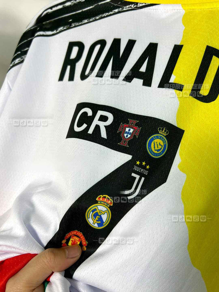 Close-up of Ronaldo tribute jersey featuring the number 7, CR7 logo, and logos of clubs like Real Madrid, Manchester United, Juventus, and Sporting Lisbon.