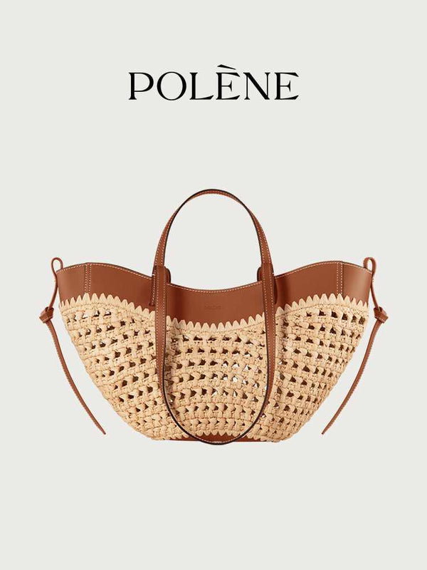 Polène Cyme raffia tote bag with cowhide leather details and adjustable shoulder strap.