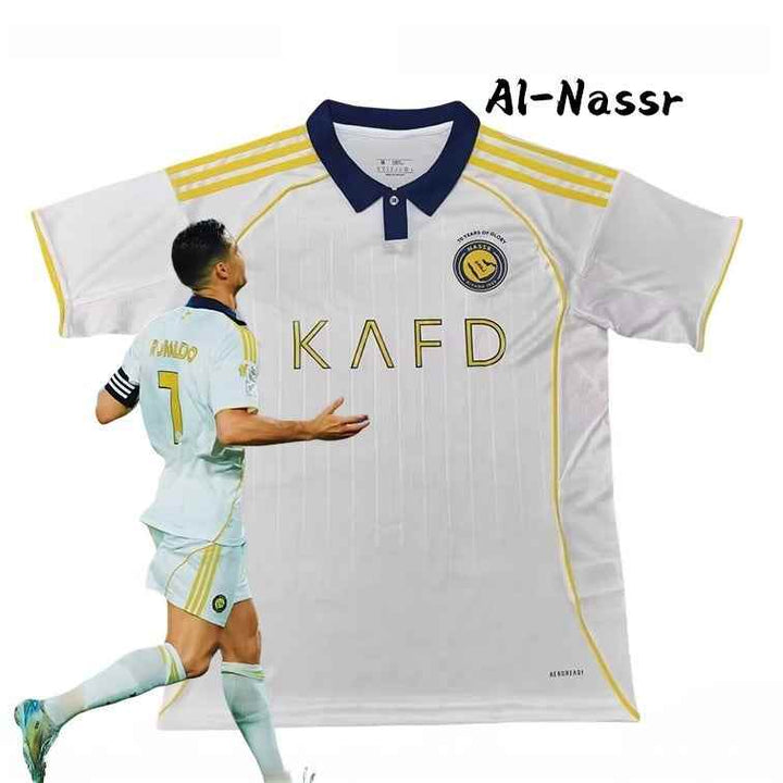 Al-Nassr 25/26 player edition white jersey with light vertical stripes, gold accents, and navy collar sports kit