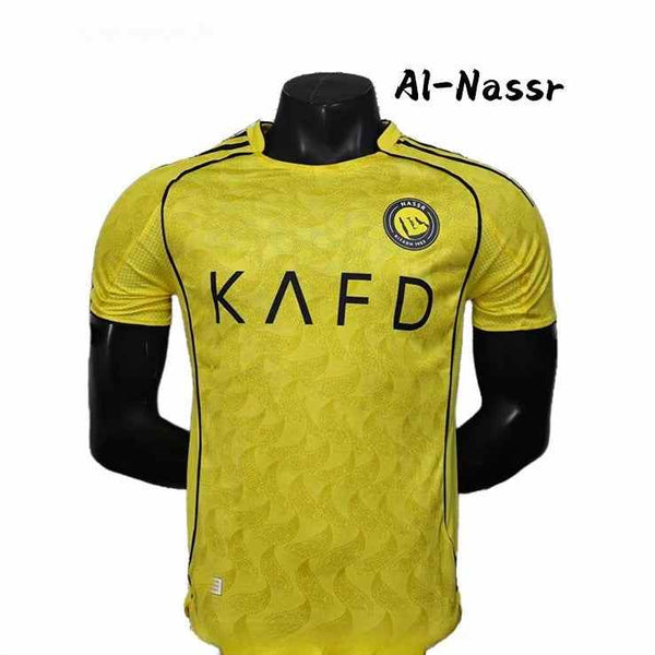 Yellow Al-Nassr football jersey with black accents and breathable fabric, featuring the club logo and KAFD sponsor.