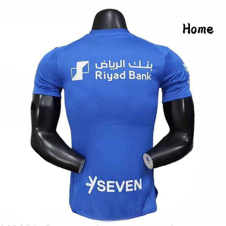 Blue Al Hilal home jersey 25/26 season with Riyad Bank and SEVEN sponsor logos on back, made from AeroReady breathable fabric, Player Edition fit.