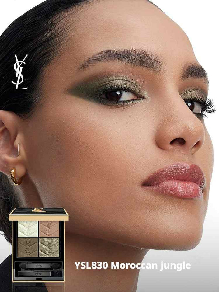 Close-up of a woman wearing YSL Couture Color Eyeshadow in YSL830 Moroccan Jungle with an elegant gold and black eyeshadow palette beside her.