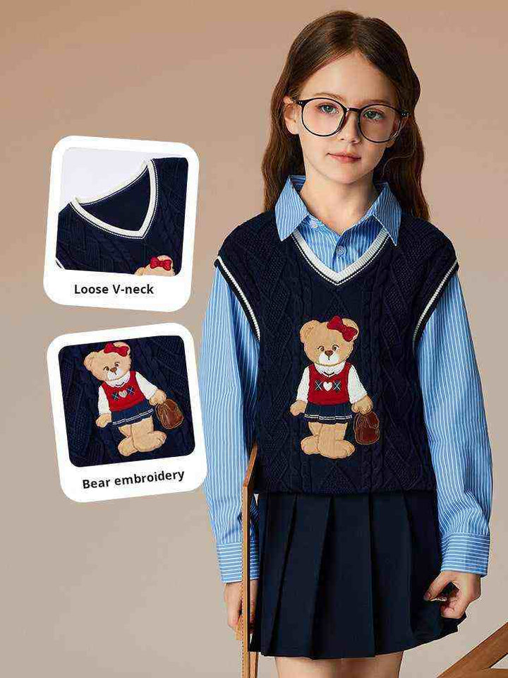 Girl wearing PawinPaw Cartoon Bear navy blue V-neck woolen vest with bear embroidery over blue striped shirt and navy skirt