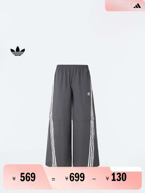 Adidas بنطال رياضي قابل للفصل رمادي بأشرطة بيضاء بسحّاب عند الركبة للرجال والنساء
