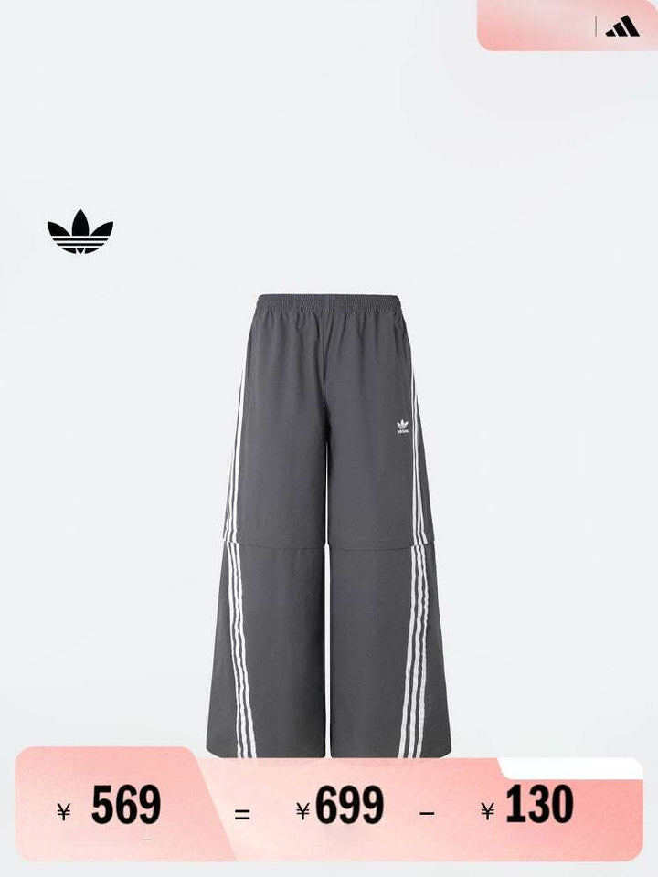 Adidas بنطال رياضي قابل للفصل رمادي بأشرطة بيضاء بسحّاب عند الركبة للرجال والنساء