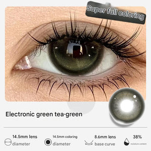 A close-up of a human eye wearing Electronic Green Tea green colored contact lenses by Tinacon.